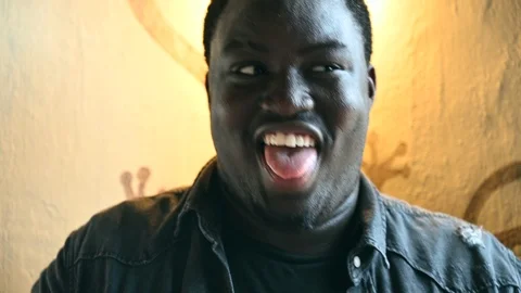 Hypnotizing happy funny dancing black man grimace silly face Video stock 106025671