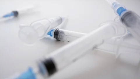 Hypodermic Needles Falling in Slow Motion Stock Footage 112473956