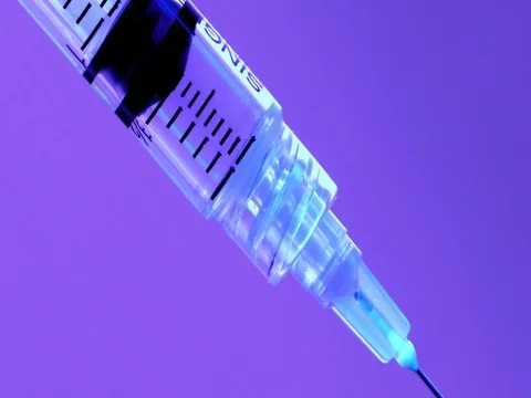 Hypodermic syringe with vial of medication. Stock Footage 76583809