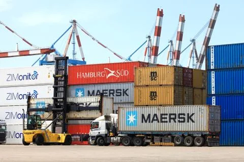 Hyster container handler lifting a Shipping Container. Stock Photos
