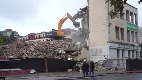 Hyundai excavator disassembles the house Stock Footage 217728628