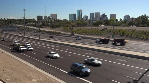 I-10 freeway traffic with downtown Phoenix, Arizona in the background Stock Footage 61221760