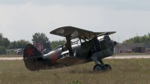 I-15 BIS Soviet single-engine fighter half-plane moves along field near runway Stock Footage 117541277