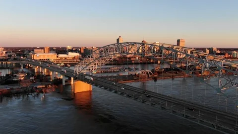 I-40 bridge reveals Memphis skyline at sunset- Establishing shot Stock Footage