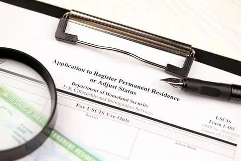 I-485 Application to register permanent residence or adjust status form and.. Stockfoto's