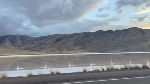 I-80 Utah driving POV shows Great Salt Lake reflections and mountains Stock Footage 321506345