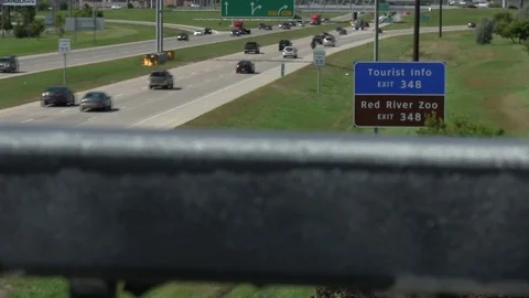 I-94 Exit 348 Fargo ND Over Guard Rail Soft Focus Zoom HD Stock Footage 113775700