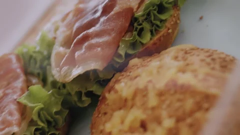 I add the bacon from the grill to the green tomato burger ingredients Stock Footage 257577281