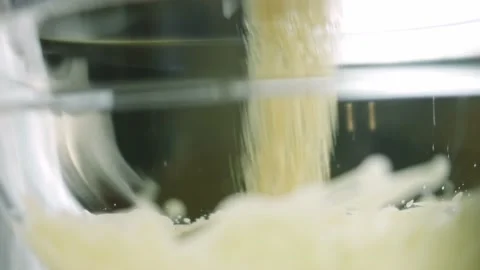 I add a cup of brown sugar. Ingredients for the dough with a spoon. The BEST Stock Footage 165363110