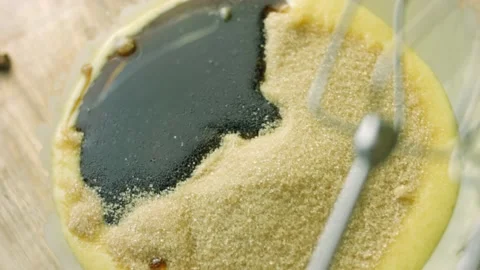 I add a cup of molasses. Ingredients for the dough with a spoon. The BEST Stock Footage 165363322