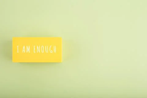 I am enough and self acceptance minimal concept on bright beige background with Stock Photos