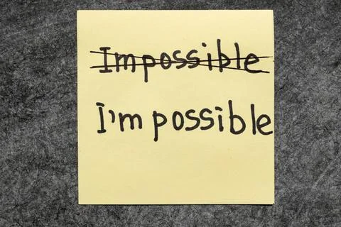 I am possible impossible - I am possible concept handwritten on yellow pap... Stock Photos