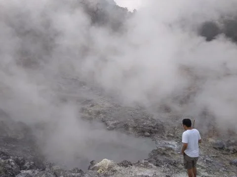 I am standing on top of an active volcano with poisonous smoke Stock Photos