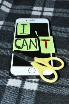 I can concept. Encourage yourself. Scissors cut off the letter t of written w Foto stock