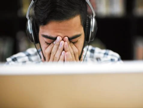I can do this if I put my mind to it. Closeup shot of a stressed out young man Fotos de archivo
