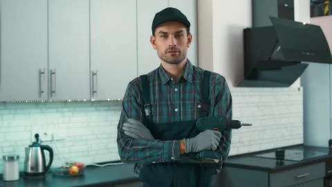 I can help. Man is ready to solve household problems Stockfoto's
