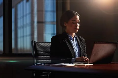 I can make a difference all by myself. a businesswoman using her laptop at her Stock Photos