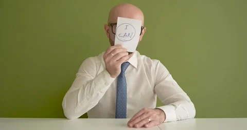 I can  - A man presents a note with the word Stock Footage 267089376