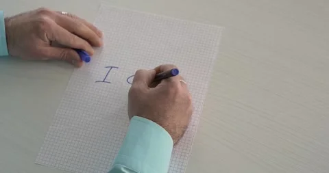 I Can  -  this word is written on the sheet by a man's hand Stock Footage 267082198