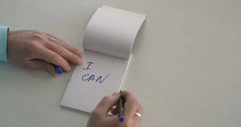I can  - this word is written on the sheet by a man's hand Stock Footage 267083210