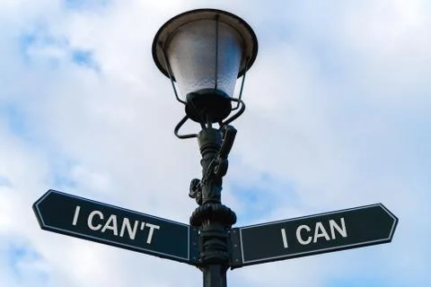 I Cannot versus I Can directional signs on guidepost Stock Photos