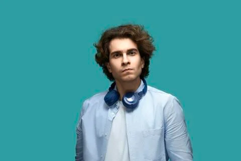 I command you. Portrait of serious young beautiful man wearing white t-shirt  Stock Photos