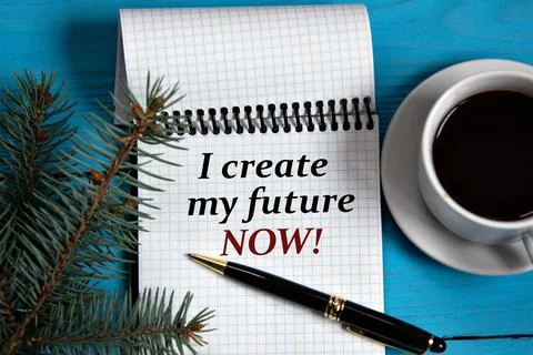 I CREATE MY FUTURE NOW! - words in a white notebook on the background of a cu Stock Photos