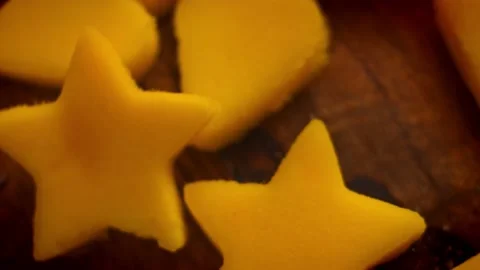 I cut the mango pieces in the shape of a heart and stars. 4k video Stock Footage 157436742