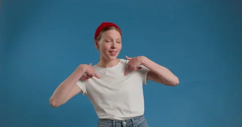 I did it myself. Joyful haughty young blonde woman in white shirt pointing Stock Footage 150403552