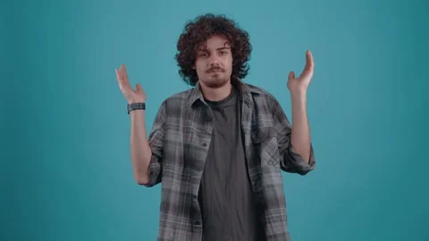 I Do I need it Curious hipster teenager with curly hair, wonders if he is next Stock Footage 149600626