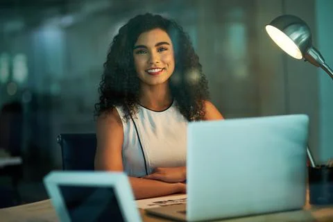 I do my best work on the late shift. Portrait of a confident young businesswoman Stock Photos