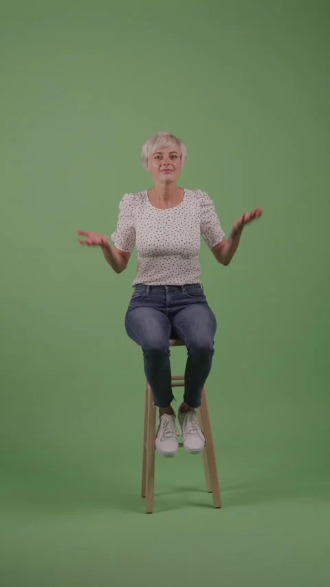 I Don't Know Expression by Woman with Pixie Haircut in Front of Green Background Stock Footage 211869175