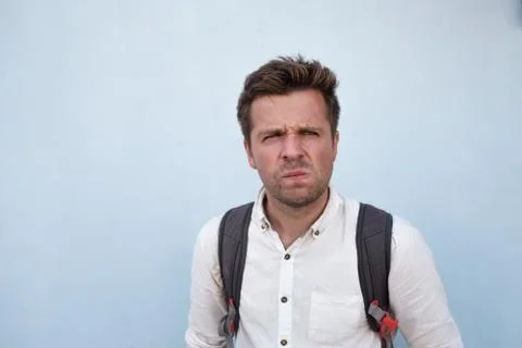 I don't know. Portrait of doubtful caucasian male looking with indecisive Stock Photos