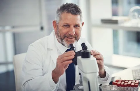 I found the answer I was looking for. Portrait of a mature scientist using a Stock Photos