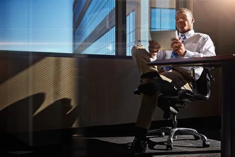 I found just the tool to solve my problems. a businessman using his digital Stock Photos