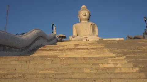 I go up the steps, Big Buddha looks into the camera lens. Video stock 106747076