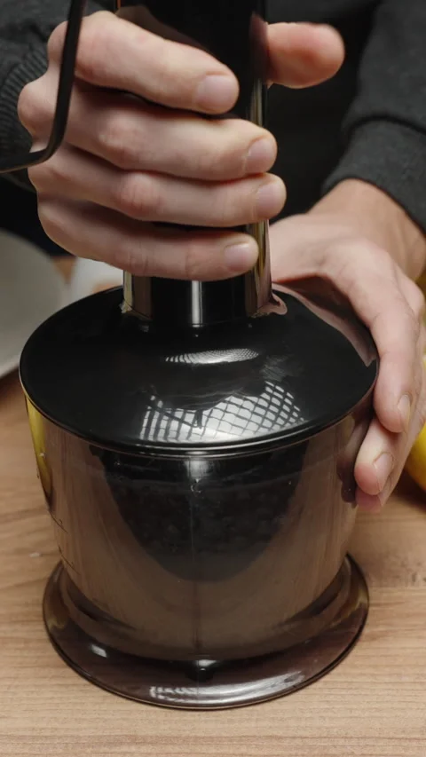 I grind Lemon in a Blender to make Lemonade at home. Vertical video Social Media Stock Footage 234187605