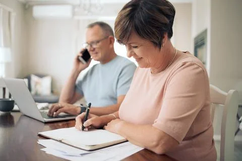 I have a few changes to make to our contract. a mature woman taking notes while Stock Photos
