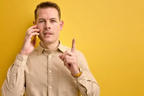 I have idea. Man sharing ideas with business partner while talking on phone Stock Photos