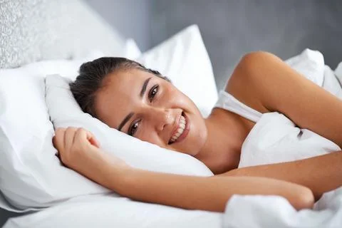 I hope Im getting breakfast in bed. Cropped shot of a beautiful young woman Stock Photos