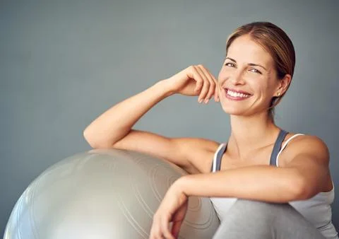 I know just the thing to get you into shape. Cropped portrait of an attractive Stock Photos
