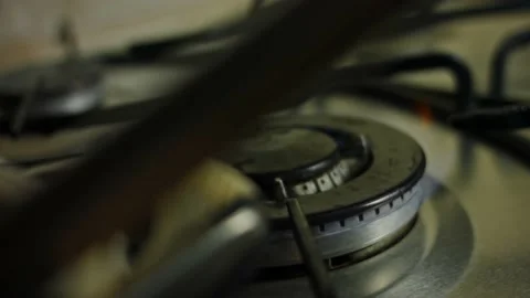I light the fire on the stove. 4k slow motions video Stock Footage 160548967
