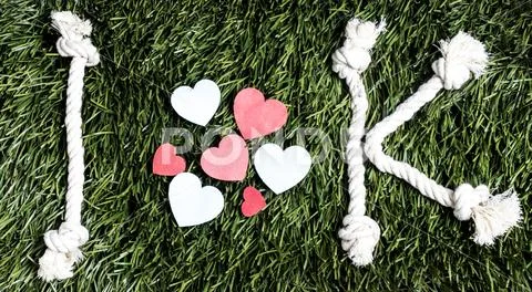 I Love K rope text layed on green grass surface. Stock Photos