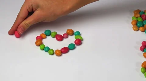 I love you of colored round candy time lapse Stock Footage 44356949