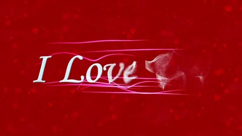 "I Love You" text formed from dust and turns to dust horizontally on red Stock Footage 71384590