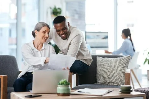 I made a few notes to follow here. two businesspeople going through paperwork Stock Photos