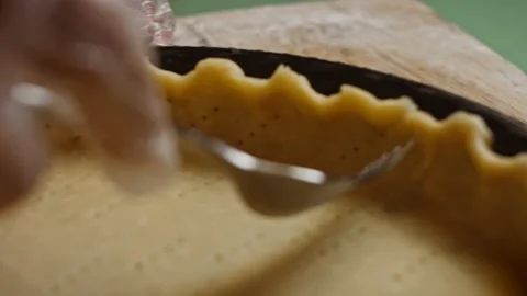 I make holes in the dough with a fork. 4k video Stock Footage 159997969