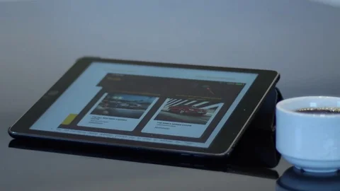 I-pad with full white cup of coffee Stock Footage 74570394
