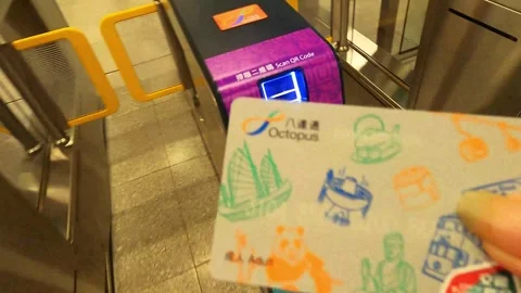I press my plastic travel card to the sensor at the machine to travel in Hong Stock Footage 342075792