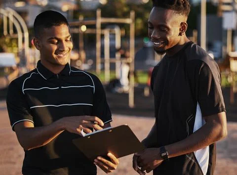 I like the programme you made for me. a young man planning his workout routine Stock-Fotos